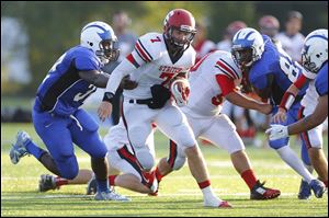 Woodward High School player Jamar Russell (32) can't catch Cardinal Stritch High school player Joe Sinay (7) during the second quarter at Woodward High School, Friday, August 29, 2014.