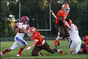 Southview's senior Leon Eggleston (22) gets some air as he leaps toward the end zone in the first quarter of the Friday, August 29, 2014, match up against St. Francis de Sales.