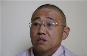 Kenneth Bae, an American tour guide and missionary serving a 15-year sentence, is detained in North Korea.