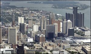 With billions in debt, Detroit on Tuesday began its federal bankruptcy trial. 