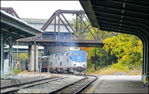 Roughly six hours late, an Amtrak train arrives Wednesday in Toledo. Dur­ing the first seven months of 2014, Am­trak’s Toledo rid­er­ship has fallen by 7 per­cent, according to statistics provided to the Toledo-Lucas County Port Authority, which owns the Toledo station.