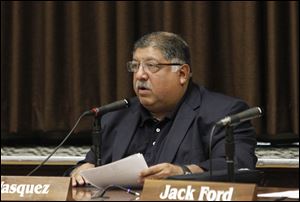 TPS Board of Education President Bob Vasquez, reads a statement to the media after the board accepted the resignation of TPS treasurer Dan Romano.