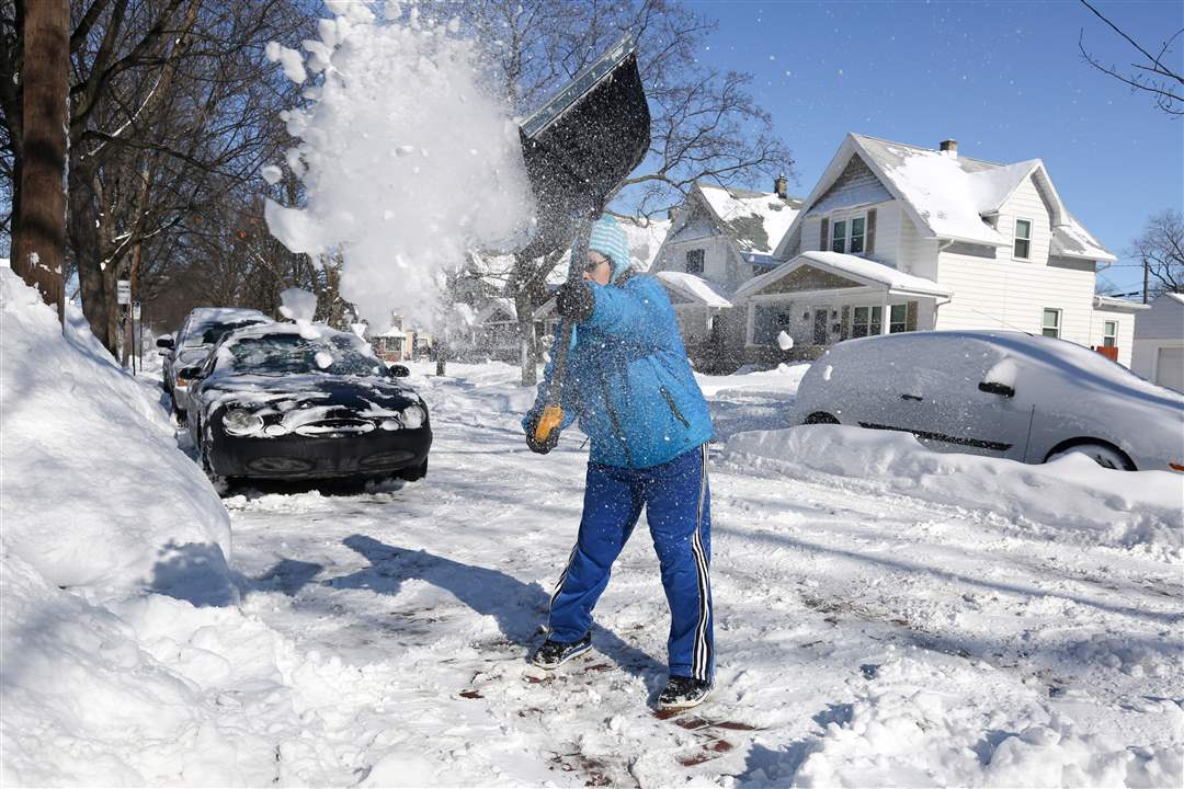 CTY-snow02pMaria-Viengmany-shovels-snow