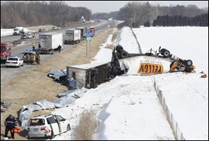 A helicopter lifts off from the scene of an accident on eastbound of the Ohio Turnpike just east of Swanton near Scott Road.