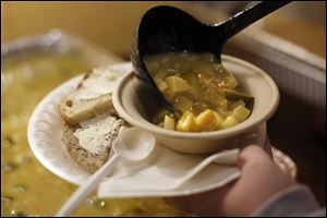 Dill Pickle soup was one of many soups to enjoy with artisan bread during a Toledo SOUP event at the Toledo School for the Arts Sunday.  Toledo SOUP is a crowd-funding opportunity for community members to help promote and fund small dollar community-based projects by making $5 donations, which gives them a soup dinner and one vote on four community-based projects presented to the audience.