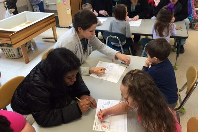 Lourdes-students-Alex-Parker-and-Talya-McNickles-with-preschoolers