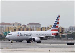 At American Airlines, passengers flew fewer miles and revenue declined 2 percent in the first quarter. But thanks to a $1.36 billion cut in its fuel bill, American reported today that it earned a first-quarter record $932 million.