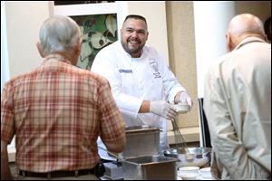 Patrick Young, center, director of culinary and nutritional services at Swan Creek  Retirement Village in South Toledo.