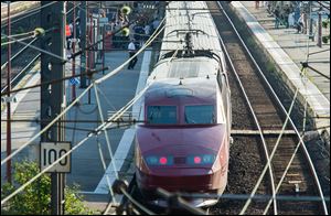 A Thalys train of French national railway operator, SNCF, stands at the main train station in Arras, northern France, after a gunman opened fire injuring three people.