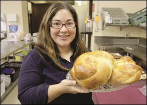 Gina Black, of Sylvania, shows loaves of challah she baked for the holiday. 