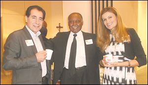 From left, Sonny Ariss enjoys a moment with Dennis Jarrett, president of the Padua Center Board, and Laila Ariss, also a board member during the Peaces of Art celebration.