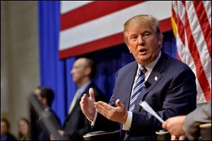 Republican presidential candidate Donald Trump speaks during a town hall meeting at the Ben Johnson Arena on the Wofford College campus, Friday,  Nov. 20.