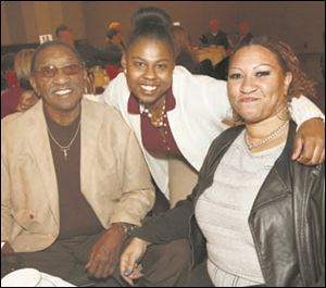 Jadah Bryant, the William Block, scholarship recipient, center, attends the Toledo Newsboys annual scholarship and sports banquet with her grandfather, Curtis Hopkins, and mother, Brandi Hopkins.