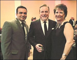 From left are David Guardiola, a social worker; Dr. Allen Flickinger, medical chairman, and Holly Hoagland-Fojtik, executive director of the Kidney Foundation of Northwest Ohio during A Wine Affair.