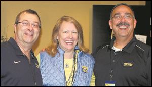 From left are Gary Corrigan, executive director, Partners in Education, Sharon Gaber, president, University of Toledo, and Mark Urrutia, general agent, Catholic Order of Foresters/Skyway Financial Group during a party in the presidents suite for the UT football game against Western Michigan.