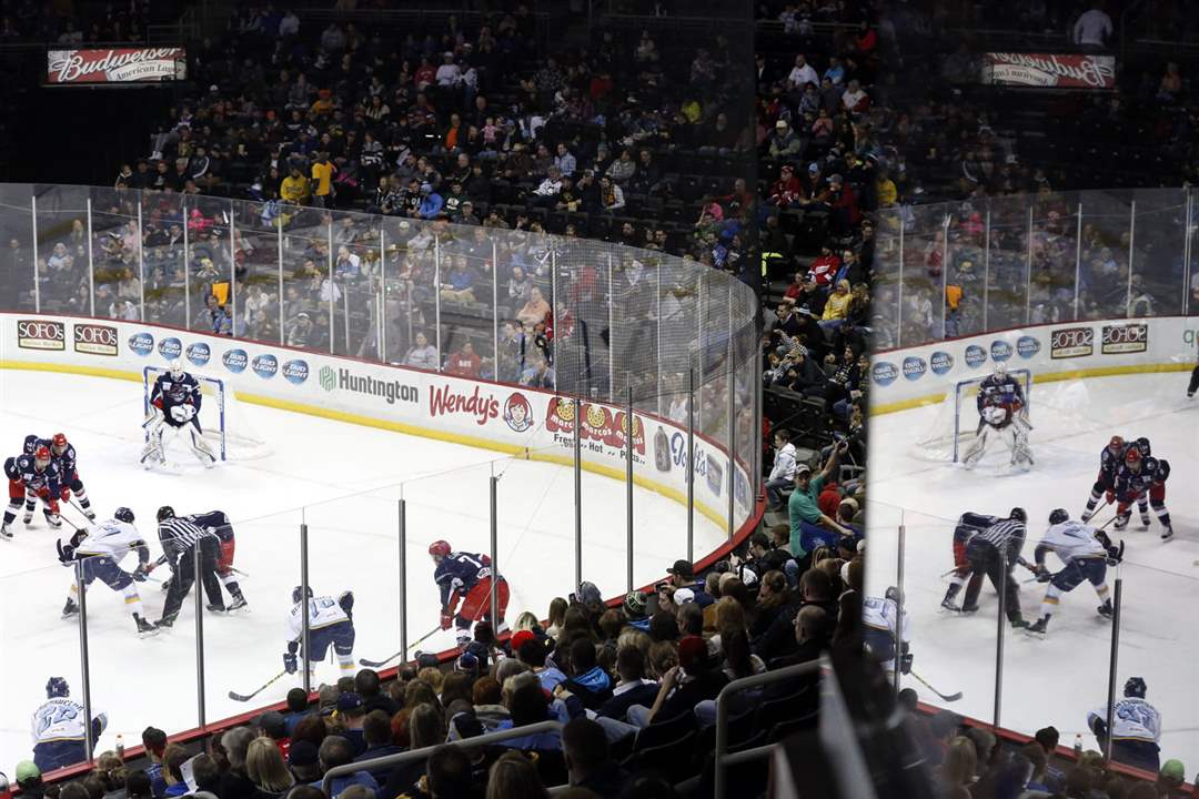 SPT-Walleye04pThe-referee-drops-the-puck