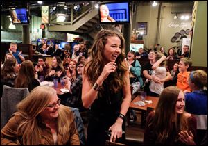 Maya Ramirez, 14, celebrates winning 'Project Runway: Junior' at a viewing party of the season finale Thursday night at Pizza Papalis in downtown Toledo. She's a ninth-grader at Toledo School for the Arts.  