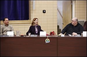 District treasurer Jeffery Fouke, left, and board members Patricia Pedro Carmean and Eric Kiser attend an emergency meeting of the Washington Local school board Saturday. The board voted 5-0 to ban ex-superintendent Patrick Hickey from school property — even for his children’s events.