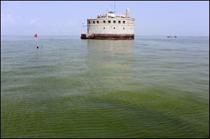 The City of Toledo water intake crib is surrounded by algae in Lake Erie in 2014.