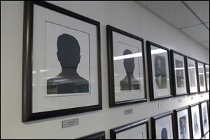 A silhouette occupies the frame for former Toledo mayor John Berdan, for whom no photo or other likeness has been found. 