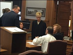 Judge Linda Jennings, center and facing camera, calls for a sidebar after Esten Ciboro, right, made a complaint to the court while he continued his cross-examination of the now 14-year-old girl who alleges she was shackled in the basement and that she was raped by both Esten Ciboro and his father Timothy Ciboro, second from right. Frank Spryszak, standing at left, is a Lucas County assistant prosecutor.    