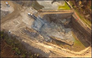 Drone images that residents in Benton Township believe show Rocky Ridge Development LLC putting spent lime and other residuals from Toledo’s water treatment plant into an abandoned quarry near them.