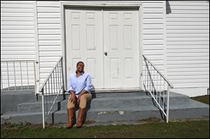 Gail Rayford-Ambeau sits outside of Rosebank Missionary Baptist Church in Tchula, Miss., which her mother attended before moving to Toledo, where Gail was born.