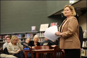 State Rep. Teresa Fedor (D., Toledo) speaks with area residents during a forum held at Start High School on the state's education plan. State Rep. Fedor would like the state to delay submitting the proposed plan until the public has had more input.