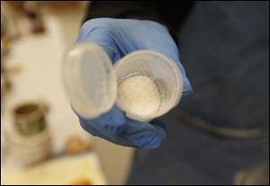 Cannabidiol crystals in a container at the Toledo Hemp Center on March 30, 2017. The Cannabidiol  is added to lotion and oils.