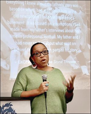 Jael Ealey Richardson, author of ‘The Stone Thrower,’ speaks to students at Jones Leadership Academy in Toledo. She is the daughter of former University of Toledo football great Chuck Ealey.