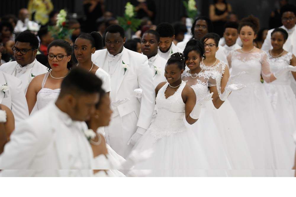 SOC-cotillion27p-Karen-Baryaruha-center-escorted-by-Ethan-Baryaruha