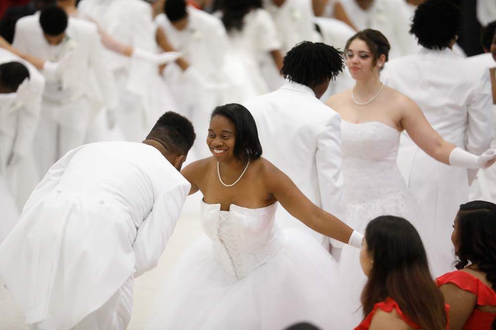 SOC-cotillion27p-Lyricka-Robinson-Smith-bows-to-her-escort-LaMarr-Smith