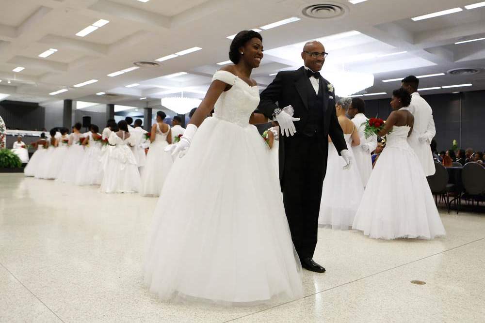 SOC-cotillion27p-Malaika-Powell-is-presented-by-Earl-Hopings