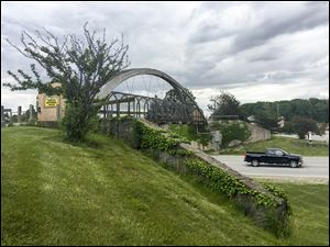 The south pedestrian bridge that spans Oregon Road and connects Owens Community College’s east and west campuses will be removed today.