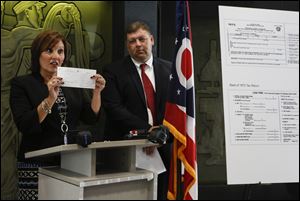 Lt. Governor Mary Taylor speaks during a press conference at 300 Madison Ave. in Toledo Wednesday.