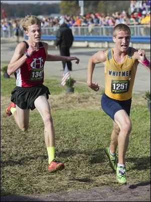 Toledo Whitmer's Nathan Cousino stays ahead of Nate Kawalec of Chardon at the finish line of Saturday's boys state cross country championships. Whitmer placed seventh as a team.