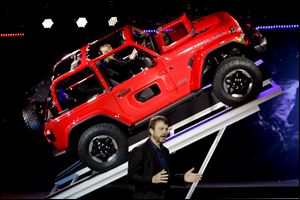 Mike Manley, president and CEO of Jeep, introduces the 2019 Jeep Wrangler during the Los Angeles Auto Show Wednesday.