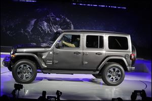 The 2019 Jeep Wrangler is introduced during the Los Angeles Auto Show Wednesday.