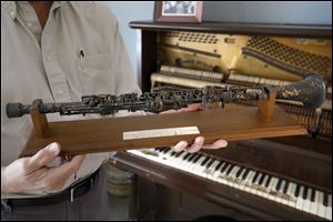 Band leader Ray Heitger keeps memorabilia, including his original clarinet, from the Ray Heiger's Cakewalkin' Jass Band at his home Thursday, November 16, 2017, in Toledo.