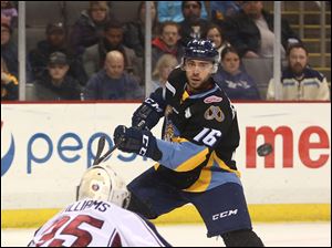 Toledo's Luke Esposito takes a shot during Friday's game against the Tulsa Oilers at the Huntington Center in downtown Toledo. The Walleye lost the game, 5-2.