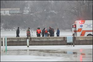 Authorities respond for a water rescue in the Maumee River in Rossford on December 11.