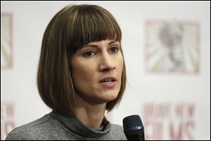 Rachel Crooks speaks at a news conference, Monday, Dec. 11, 2017, in New York.