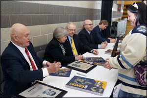 Inductees to the Toledo Hockey Hall of Fame sign autographs in January of 2016.