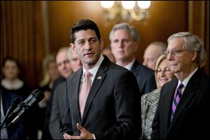 Speaker of the House Paul Ryan praises the Republican tax bill at an enrollment ceremony at the Capitol in Washington Dec. 21.