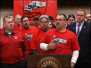 Fiat Chrysler Transportation fleet driver Sysco Garza speaks during a protest at UAW Local 12 against the proposed elimination of jobs at the Toledo Jeep transportation facility.