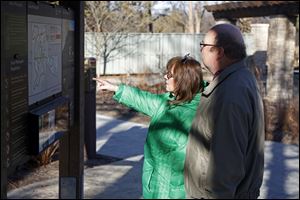  Ruth and Dennis Gwynne decide which trail they'd like to go on at Secor Metropark in Sylvania.