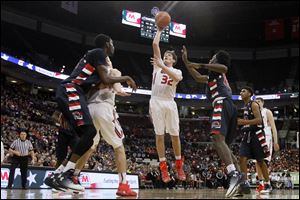 Wauseon's Brooks Gype takes it to the net under pressure from Eastmoor Academy's defense during last year's state tournament. 