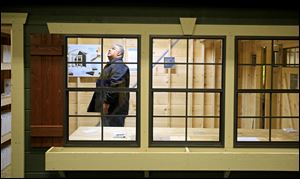 Dion Alvarez, of Toledo, checks out a Weaver Barns shelter during the HBA House and Home show at the SeaGate Convention Centre.