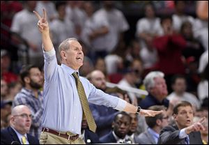 Michigan head coach John Beilein gestures during a game against Maryland.