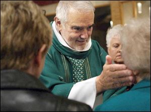 Though he considers himself semiretired, Father Richard McAlear is often on the road three weeks out of the month for his healing ministry.